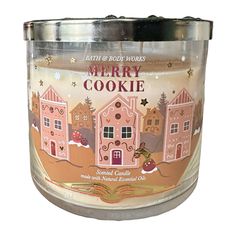 a candle that is sitting in front of a white background with the words merry cookie on it