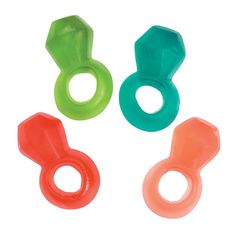 three different colored plastic rings on a white background