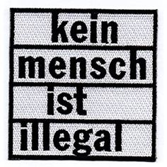 a patch with the words kein mensch ist illegal in black and white on it