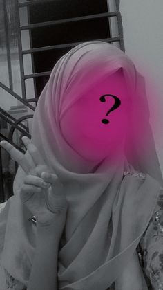 a woman wearing a headscarf with a question mark on it