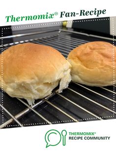 two rolls sitting on top of a metal rack in front of an oven with the words thermomiia fan - recipe