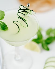 a drink with green garnish on the rim