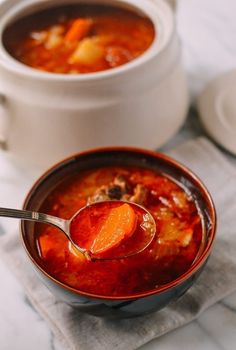 a bowl of soup with a spoon in it