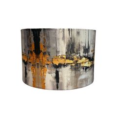 an abstract painting is shown on the side of a lamp shade that has yellow and black paint