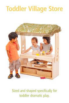 two children playing in a wooden play house with the words toddler village store on it