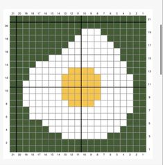 a cross - stitch pattern with yellow and white squares on it, in the shape of a flower