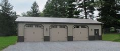 three car garage with two windows and one door