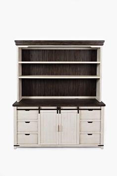 a white bookcase with drawers and cupboards on it's sides, against a white background