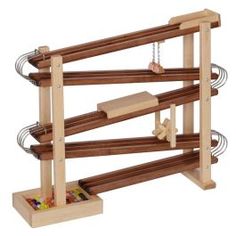 a wooden toy rack with several pieces of wood and metal bars on it's sides