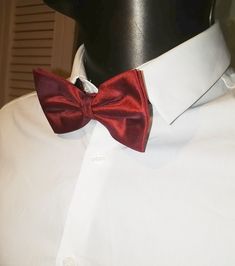 Claret red silk bow tie by Austin Reed. Adjustable length. Fitted Red Bow Tie For Black Tie Events, Classic Red Ties For Party, Red Bow Tie For Black Tie Occasions, Red Bow Tie For Formal Occasions, Red Adjustable Tie For Formal Occasions, Adjustable Red Ties For Formal Occasions, Elegant Red Bow Tie For Party, Elegant Red Bow Tie For Formal Occasions, Classic Red Bow Tie For Formal Occasions