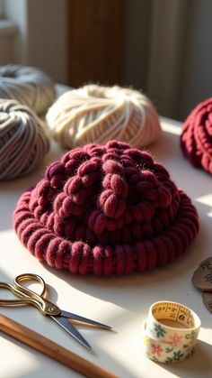 various yarns and scissors on a table