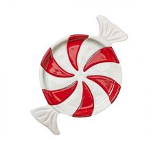 a red and white plate with a candy cane in it's center on a white background