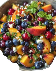 a close up of a bowl of fruit salad