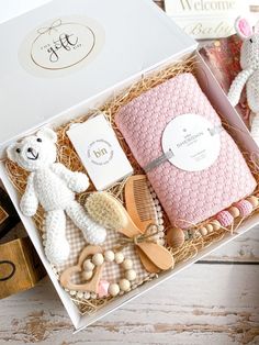 a teddy bear and other items in a box