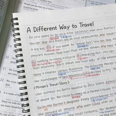 a notebook with the words a different way to travel written on it