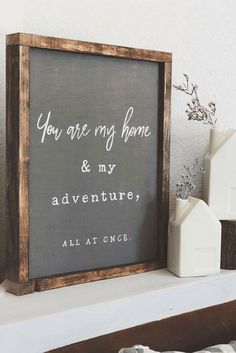 a sign that says you are my home and my adventures all at once on a mantle