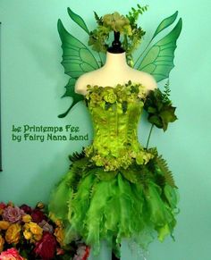 a dress made out of green leaves and flowers