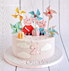 a birthday cake with pep the pig decorations