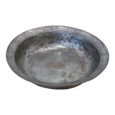 an old metal bowl on a white background