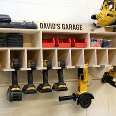 a wall mounted tool rack filled with tools