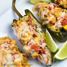 stuffed jalapenos with cheese and other toppings on a white plate