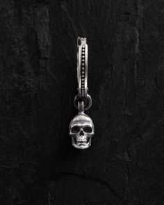 Unleash your inner warrior with the Skull Mens Hoop Earrings, a sterling silver masterpiece that symbolizes wisdom, resilience, and courage. Crafted with precision, this single earring marries style and substance, making it a perfect addition to any modern man's wardrobe. The skull design is meticulously detailed, measuring 0.3 x 0.2 inches (0.8 x 0.5 cm), and serves as a powerful talisman, reminding you to bravely face and overcome life's challenges. The hoop itself stands at 1 inch (2.5 cm) in Male Hoop Earrings, Mens Hoop Earrings, Earrings Mens, Mens Earrings, Inner Warrior, Mens Earrings Hoop, Skull Earrings, Ancient Symbols, Skull Design