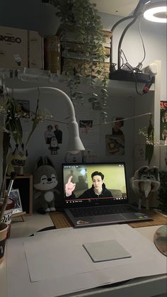 a laptop computer sitting on top of a desk