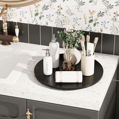 a bathroom sink with soap, toothbrushes and other items on the counter top