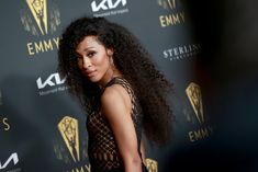 an image of a woman with long hair on the red carpet at an awards event