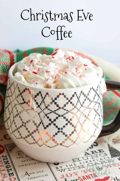 a white bowl filled with whipped cream and candy canes on top of a table