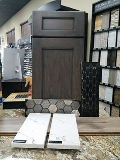 the flooring store has many different types of tile and wood in it's display area