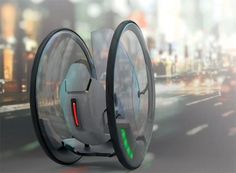 a futuristic vehicle with two wheels on the road