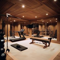 a home gym with treadmills, exercise equipment and other personal care items in the room