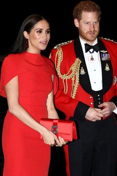 prince harry and his wife, the duke of cambridge pose for a photo in their red outfits