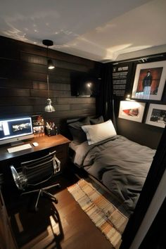 a bedroom with a bed, desk and pictures on the wall