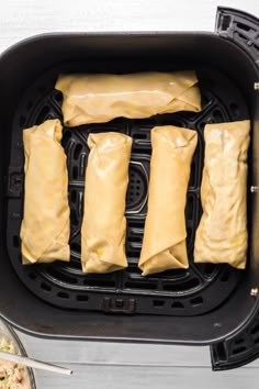 some food is being cooked in a small air fryer