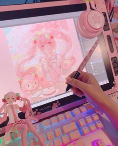 a person is drawing on a laptop with a pink background and anime characters behind it