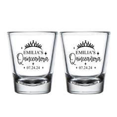 two shot glasses sitting side by side on top of each other, with the names and date printed on them