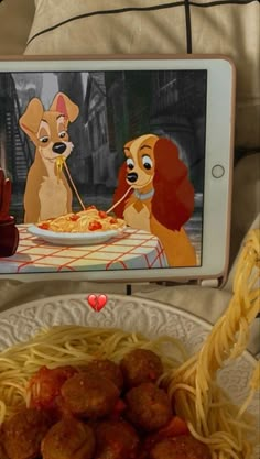 the lady and the tramp app on an iphone with spaghetti in front of it