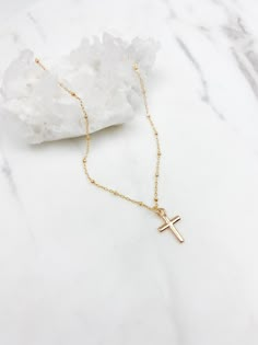 "cross necklace, gold filled cross necklace, gold cross necklace, dainty jewelry, gifts for her, religious necklace, gift for women Gold filled cross necklace D E T A I L S: *Tiny gold filled cross pendant is approx 14mm *Gold filled chain- choose your perfect length at checkout *Model wearing 18\" length Water & tarnish resistant, and hypoallergenic! Gold filled jewelry is durable & tarnish resistant. Gold filled quality products are suitable for daily wear and is also water resistant. Yes, you Dainty 14k Gold Cross Necklace As A Gift, Dainty 14k Gold Cross Necklace Gift, Gold Cross Necklace For Gift, Gold Cross Necklace Aesthetic, Elegant Gold Tarnish-resistant Cross Necklace, Cross Necklace Aesthetic, Cross Necklace Womens, Dainty Gold-plated Cross Necklace Gift, Cross Necklace Gold