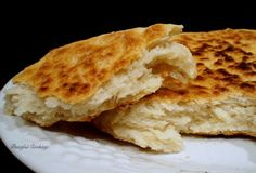 two grilled cheese sandwiches on a white plate