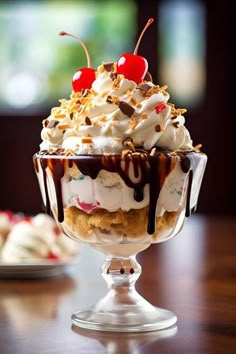 an ice cream sundae with cherries and whipped cream