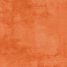 an orange background that is very soft and has some stains on it in the middle