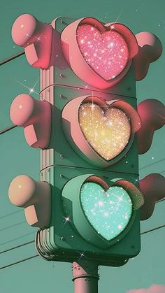 a traffic light with two hearts on it