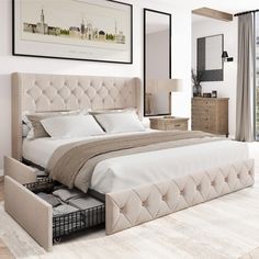 a bedroom with a bed, dressers and mirror in it's center area