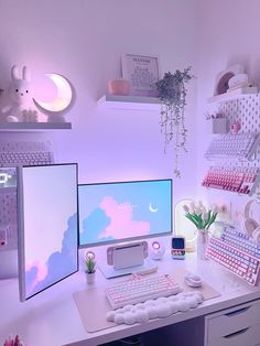 a white desk topped with a computer monitor and keyboard