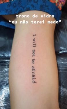 the back of a woman's leg with words written in spanish and english on it