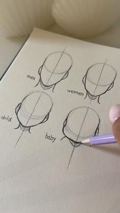 a person is drawing different types of hot air balloons on paper with a pencil in their hand