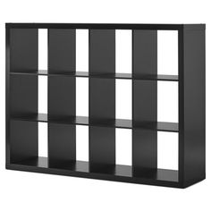 a black bookcase with six compartments and four doors