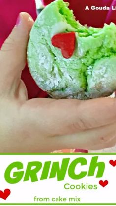 a hand holding a green and red doughnut in it's palm with the words grin cookies on it